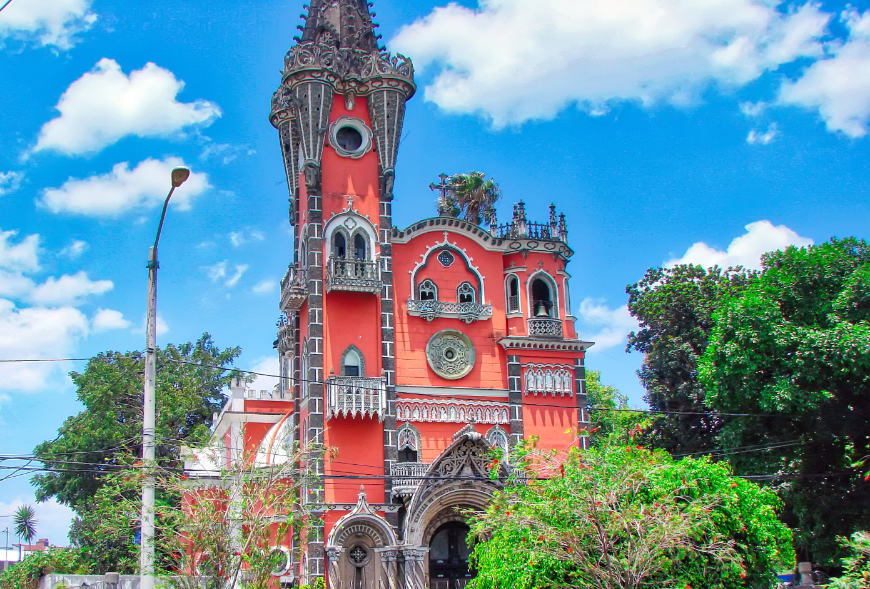 Belize and Guatemala Itinerary Image: The ornate coral colored Iglesia Yurrita.